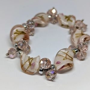 Unique stretch bracelet with pale pink, glass and plastic beads